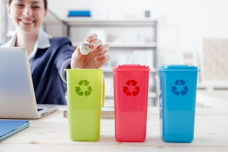 3 recycling containers on a work desk