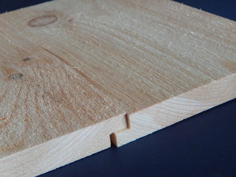 Wooden boards cut as shiplap siding